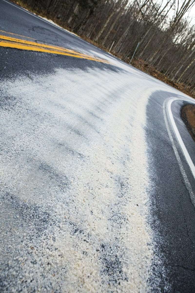 Road salt along an Adirondack roadway. A road salt task force is studying alternatives to heavy road salt use.