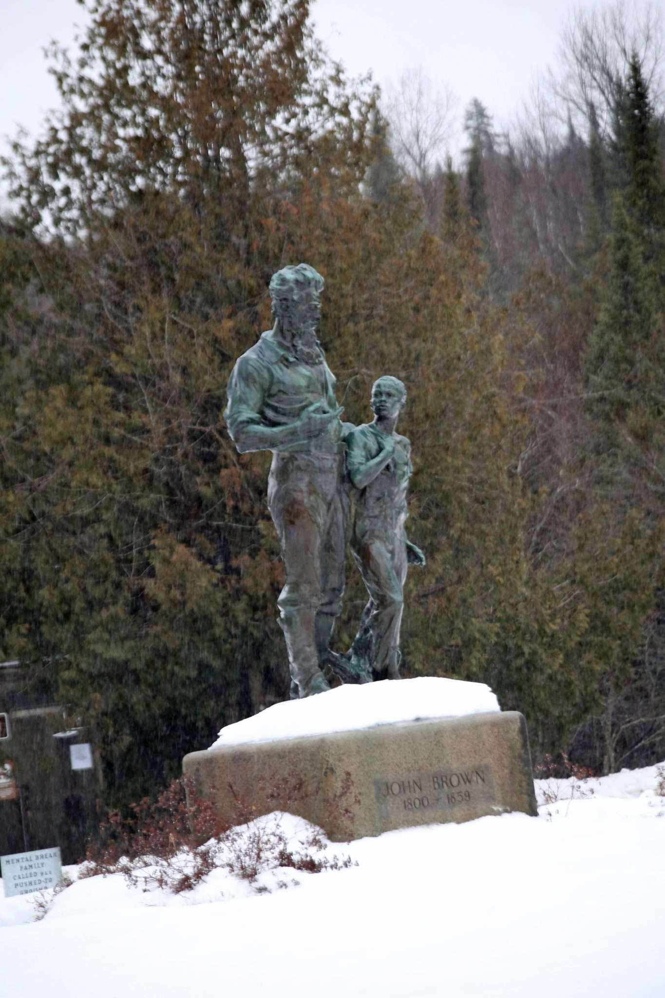 A statue of abolitionist John Brown and an African American child at John Brown Farm in North Elba.