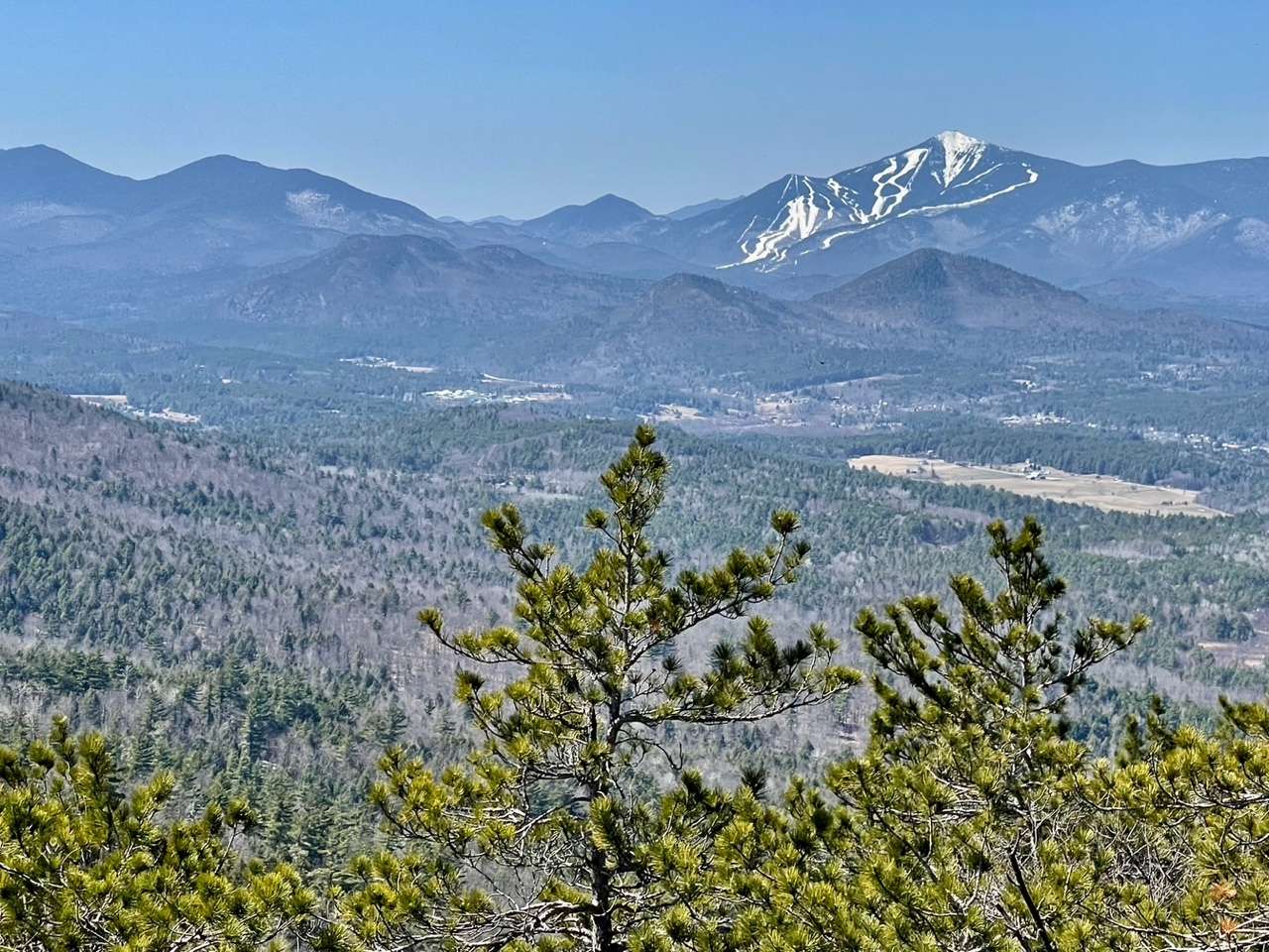 The East Branch of the Ausable River Valley and Foupeaks in the foreground, with Whiteface in the distance.