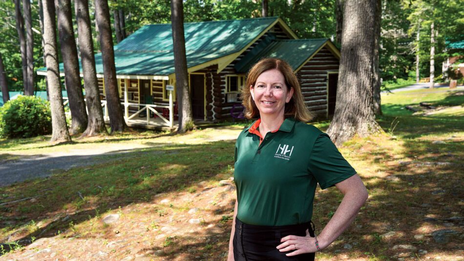 woman in green in woods