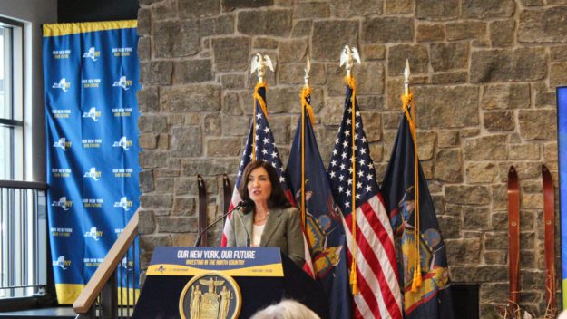 Gov. Kathy Hochul speaks to a room of people at Mount Van Hoevenberg