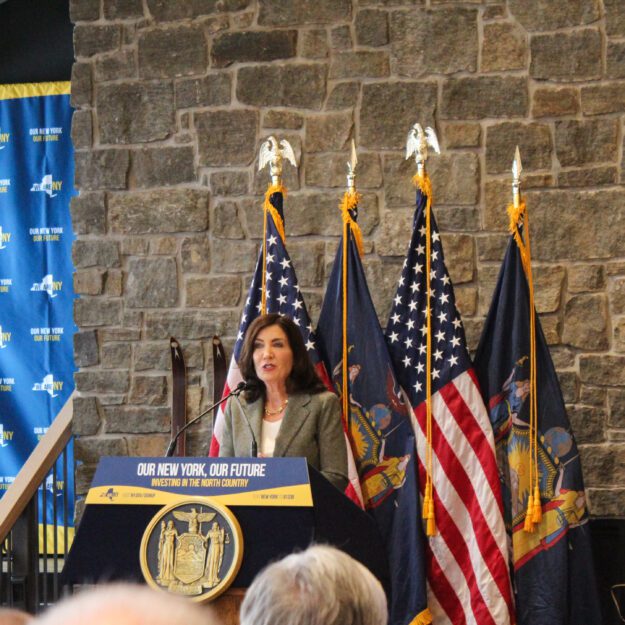 Gov. Kathy Hochul speaks to a room of people at Mount Van Hoevenberg