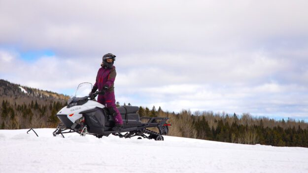 A snowmobile rider on an electric snowmobile.