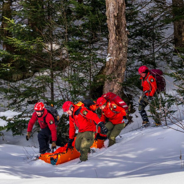 rangers in red conducting a rescue. rangers have been pushing for retirement eligibility equal to other areas of law enforcement