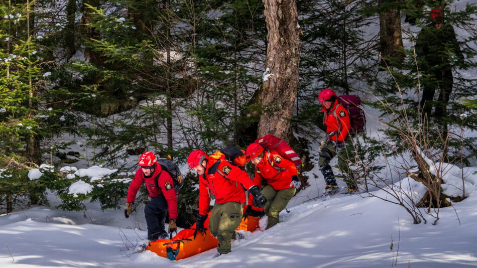 rangers in red conducting a rescue. rangers have been pushing for retirement eligibility equal to other areas of law enforcement