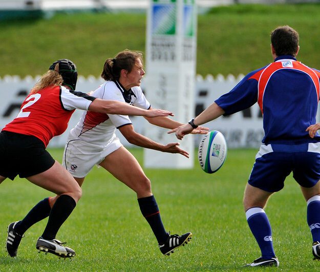 Claudia Braymer playing rugby