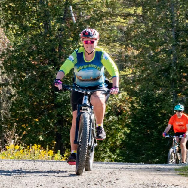 people riding e-bikes