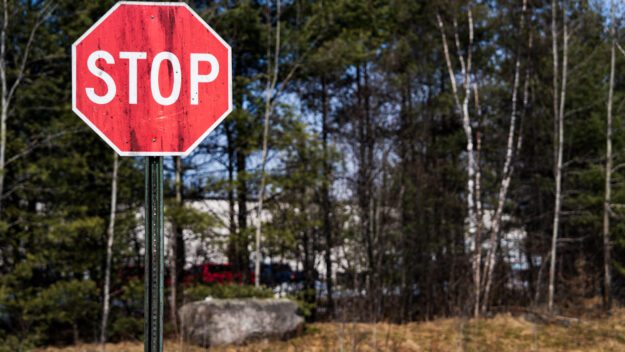 A stop sign near the WhistlePig facility in Mineville shows black staining.