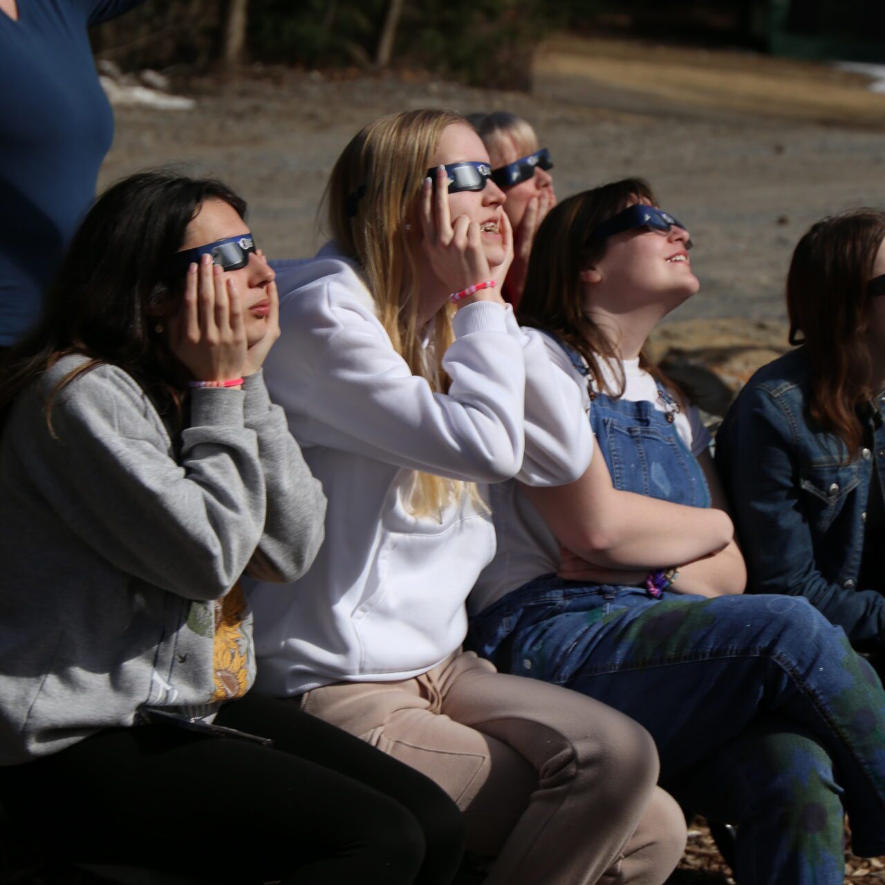 The Girl Scouts of Northeastern New York and their families watch the solar eclipse at Hidden Lake Camp in Lake Luzerne. Photo by Gwendolyn Craig