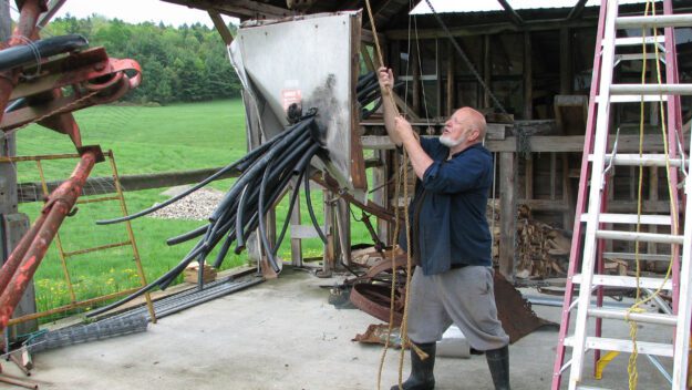 artist ted cornell at work on his art farm