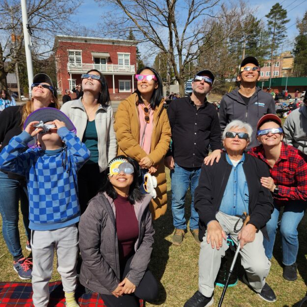 A group watching a solar eclipse