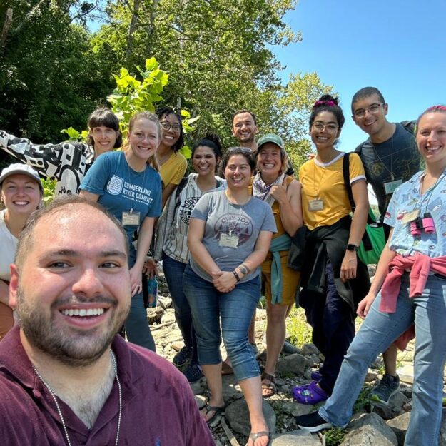 A group outside in the summer by the Potomac River