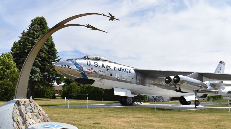 A monument to commemorate the 380th Bombardment Wing’s winning of an annual Strategic Air Command Bombing and Navigation competition arches over a B-47 at the Plattsburgh Air Force Base Museum.