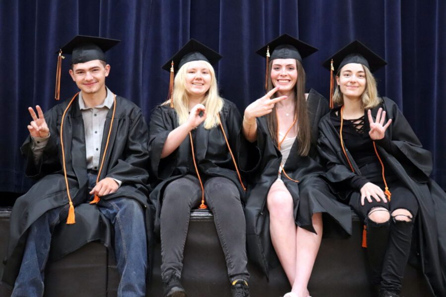 Indian Lake's graduating seniors spell out "2024" with their hands. 