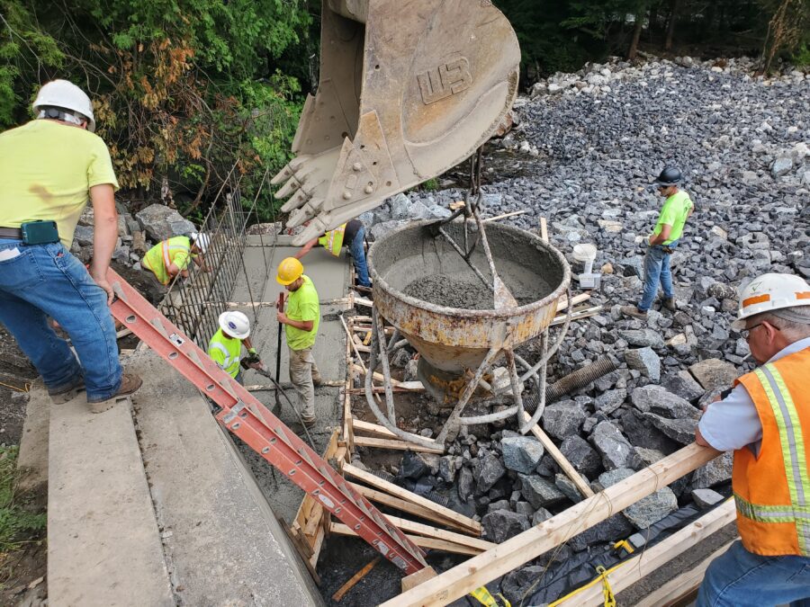 Crews working on pouring new concrete to bolster the spillway at Bartlett Carry Dam this summer. 