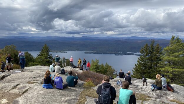 Hikers on Buck Mountain in Fort Ann overlooking Lake George on an October day in 2020.