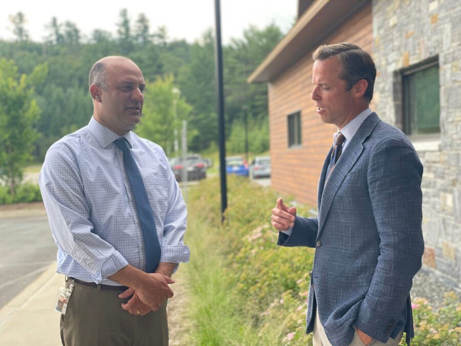 Adirondack Health COO Aaron Kramer talks with Hudson Headwaters CEO Tucker Slingerland outside Hudson Headwaters' new Lake Placid health center. 