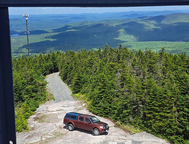 Red truck on a mountaintop.