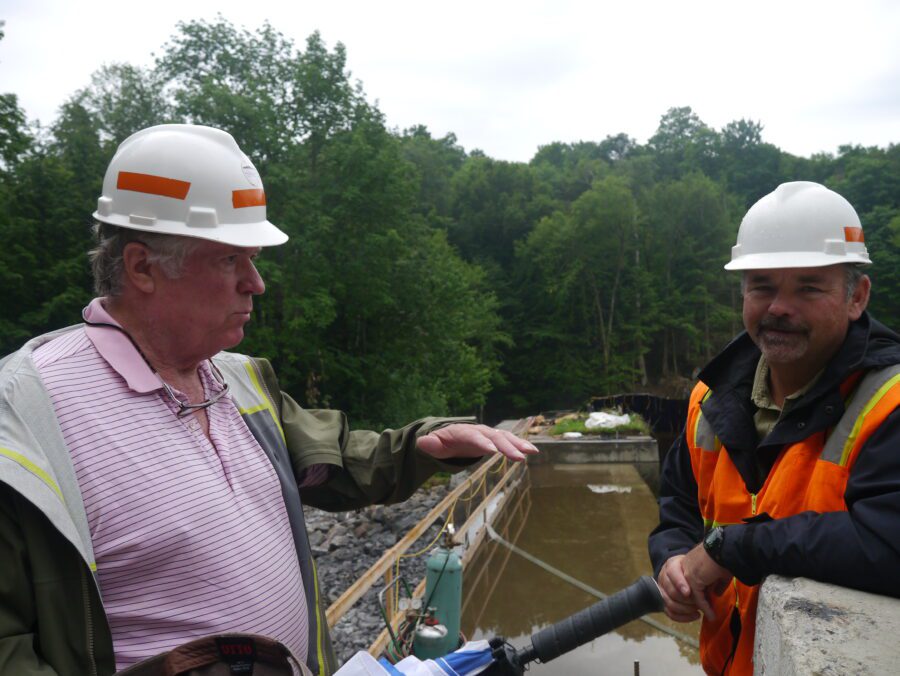 two men in hardhats at the Bartlett Carry dam