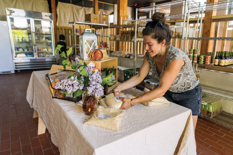 Woman stocks store shelves