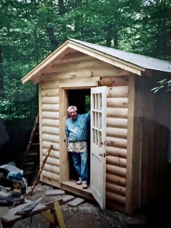 John Van Buiten making a miniature schoolhouse for his miniature route 66