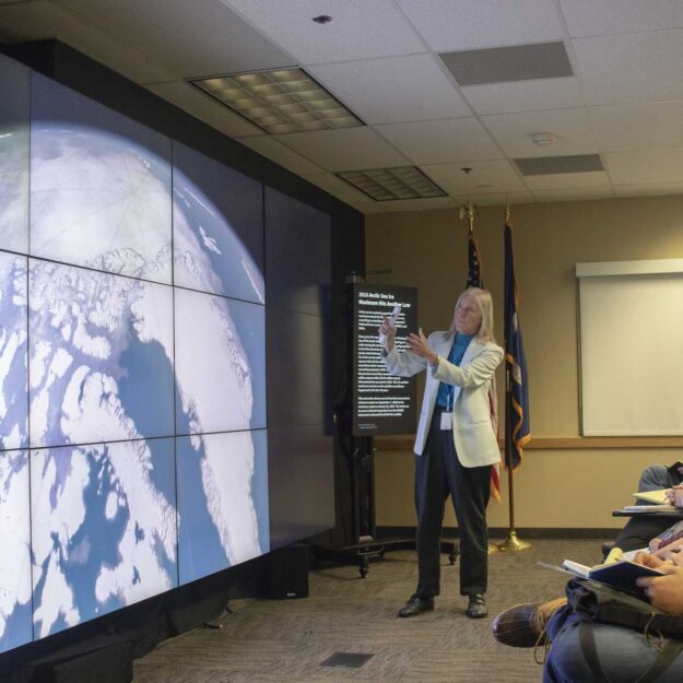 Dr. Claire Parkinson describes some of her research on our planet's changing ice to the Earth to Sky Academy class of 2019 using Goddard Scientific Visualization Studio imagery projected on the NASA hyperwall.