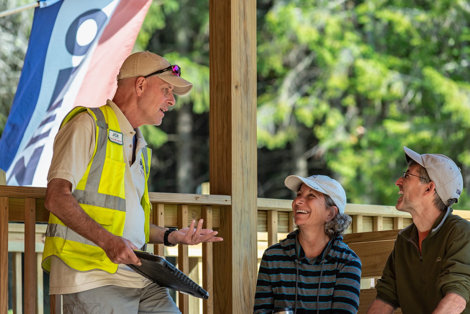 Jim Schneider, shown here talking to hikers at ADK's High Peaks Information Center near Lake Placid, has helped expand the program to Buck Mountain near Lake George. Photo by Ben Brosseau, courtesy of ADK