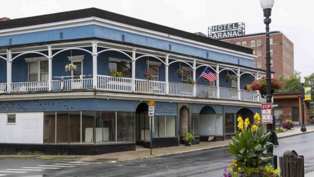 blue colored historic Loomis building in Saranac Lake