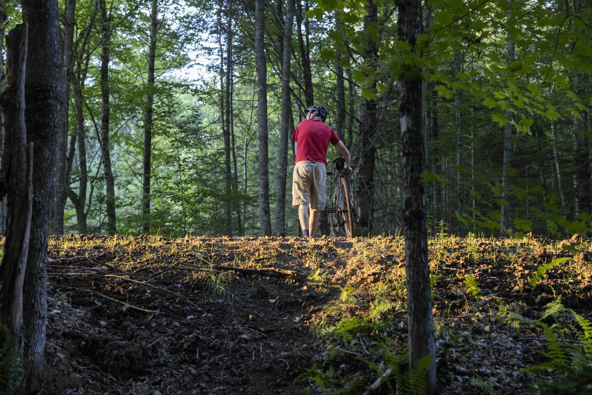 Phil Brown checks out the Adirondack Rail Trail after emerging from trails near Rat Pond. Photo by MIke Lynch