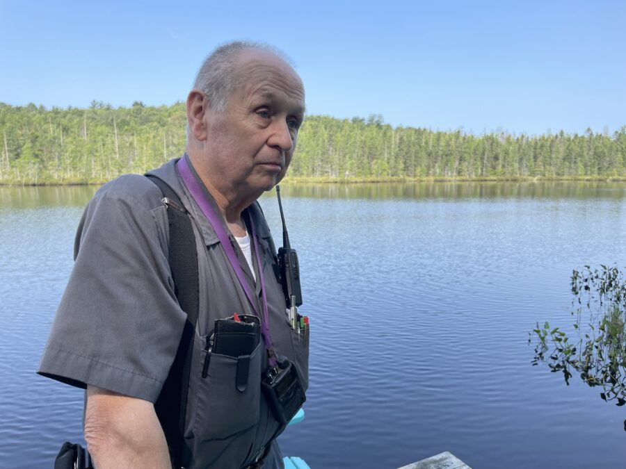 A man standing in front of water body 