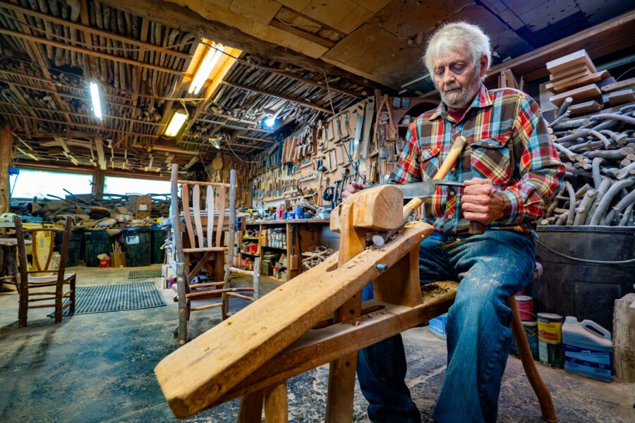 Rustic furniture maker and Adirondack wood worker Barry Gregson in his wood shop in Schroon Lake