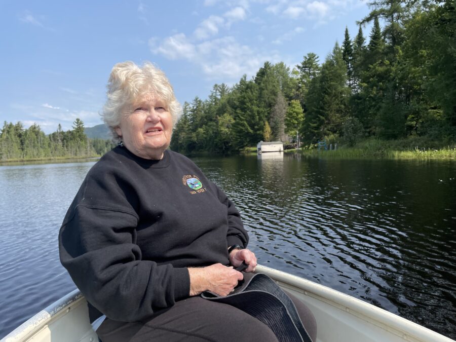 A woman in black sweatshirt on a boat