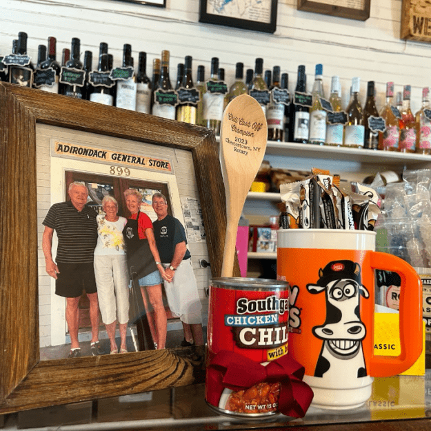 A family photo of Diane Cain sits atop her vintage candy display, beside an award for winning the local chili cookoff.