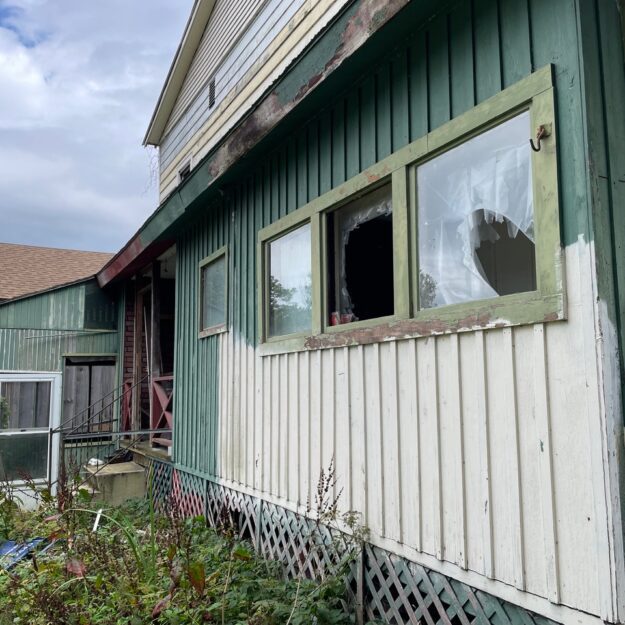 vacant house with windows broken