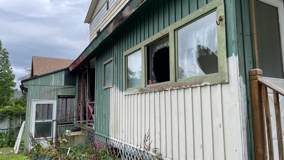 vacant house with windows broken