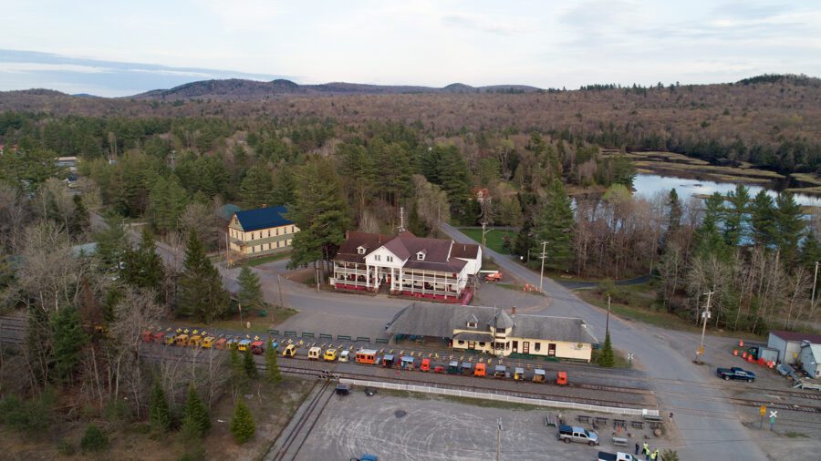 Historic inn by a railroad track.