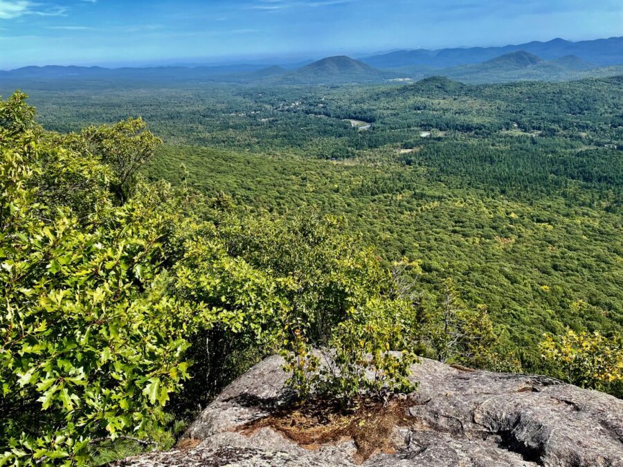 Looking down on the Town of Wilmington with Hamlin and Quaker mountains in the foreground and the Jay Range in the distance.
