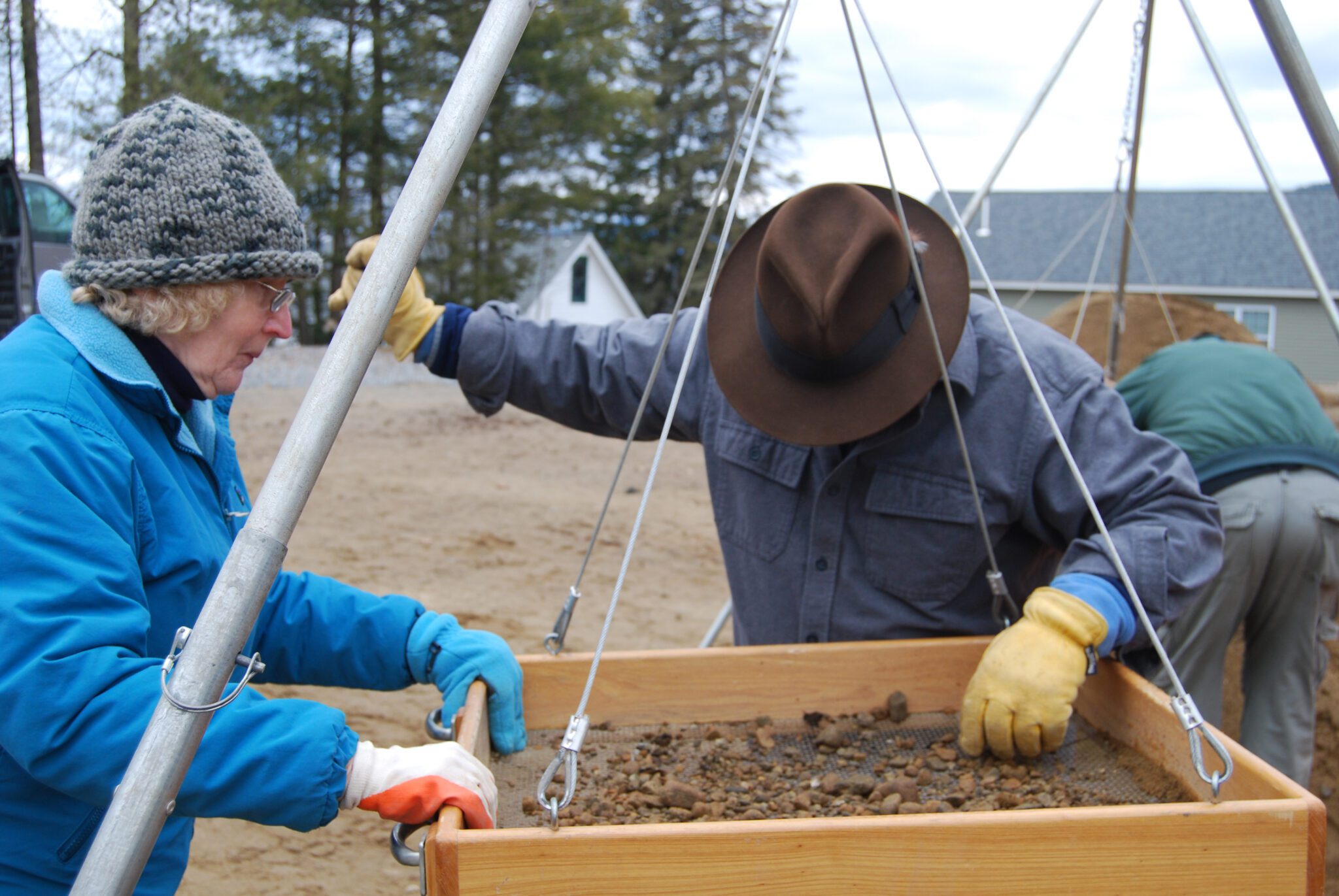 Lyn Karig Hohmann and Charles Vandrei sift for artifacts and 18th-century human remains, discovered during a construction project on Courtland Street in the Village of Lake George