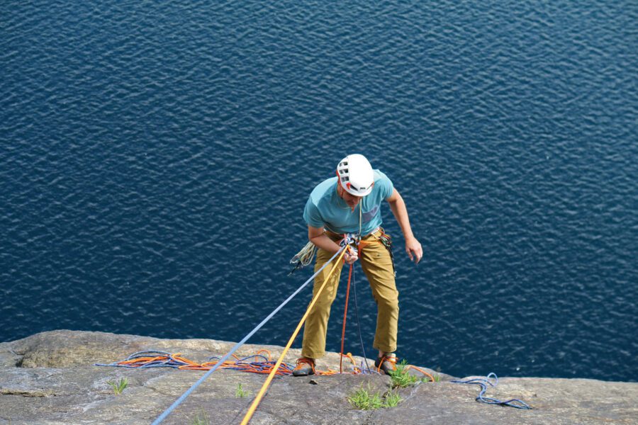 rock climber over water, climbing on Lake George