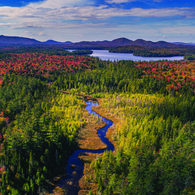 An aerial photo of the Adirondack Park in the fall