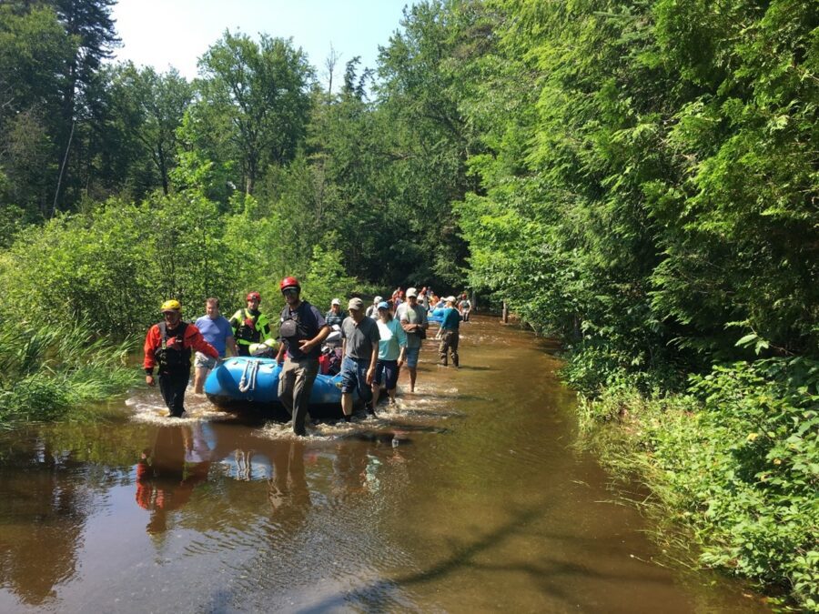 A rescue in life boats after major rain and flooding