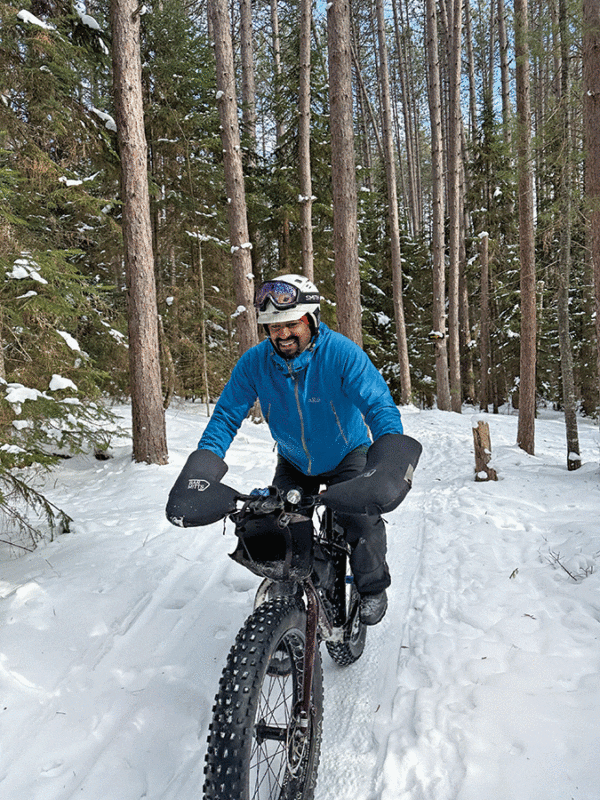 Justin Oliver, owner of Silver Birch Cycles in Saranac Lake, rides his fat bike year-round. Photo by Phil Brown 